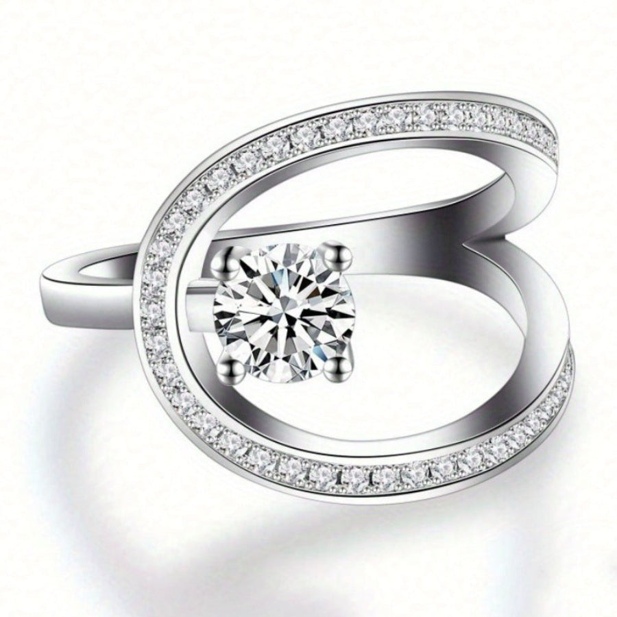 Geometric Open‑Band Ring Four‑Prong Center Diamond With Paved Side Stones