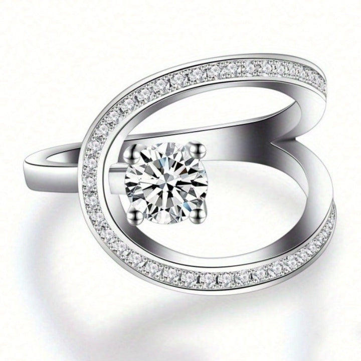 Geometric Open‑Band Ring Four‑Prong Center Diamond With Paved Side Stones