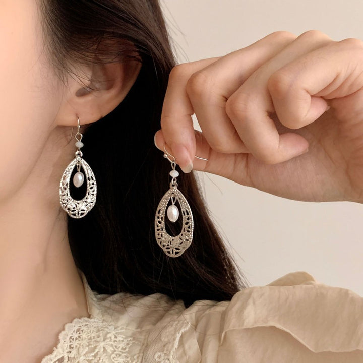 Vintage-style hollowed-out teardrop pearl long earrings