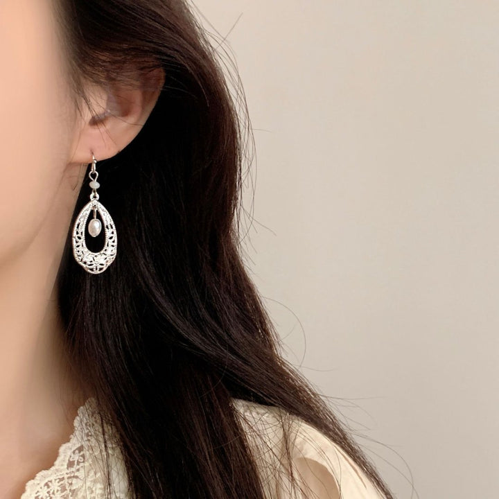 Vintage-style hollowed-out teardrop pearl long earrings