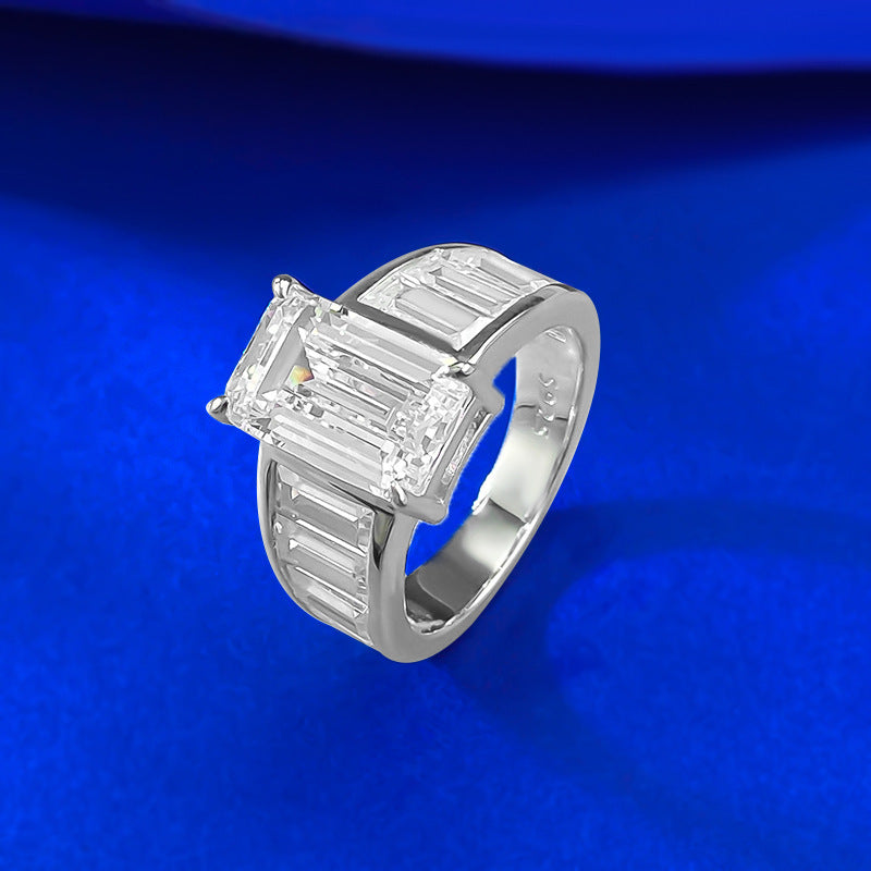 Emerald Cut Diamond Three-Stone Ring with Side Baguette Accents