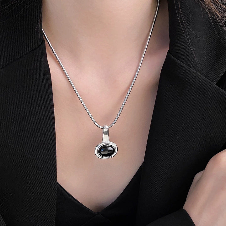 Black Gemstone Necklace With Snake Chain And Round Pendant