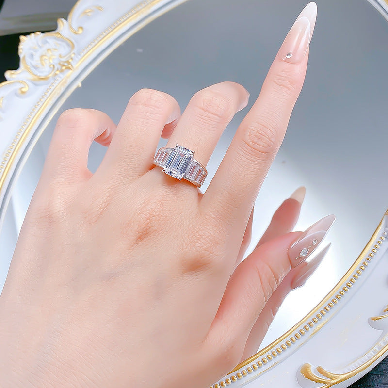 Emerald Cut Diamond Three-Stone Ring with Side Baguette Accents