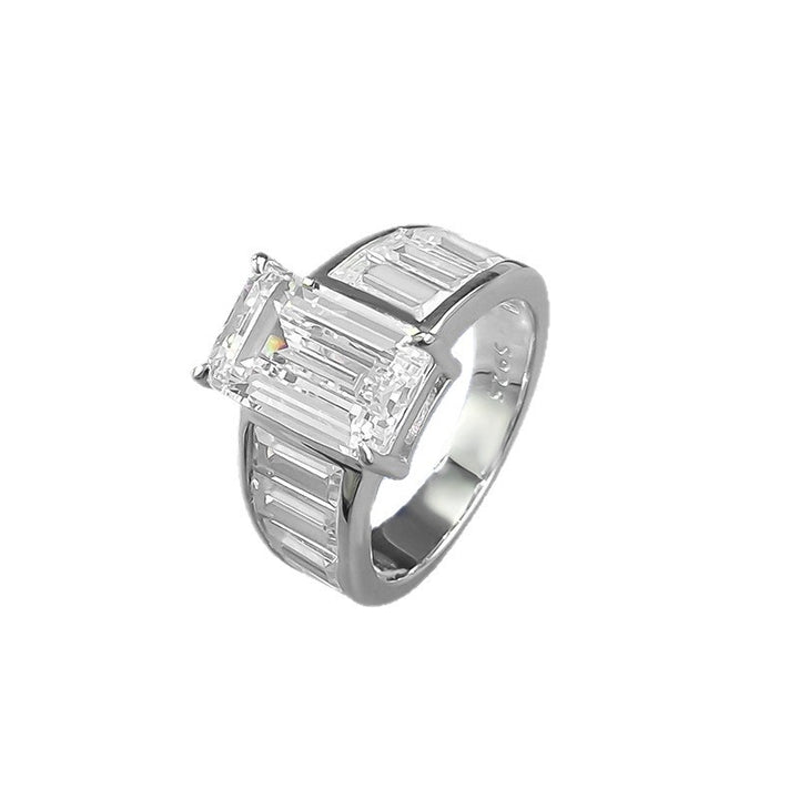 Emerald Cut Diamond Three-Stone Ring with Side Baguette Accents