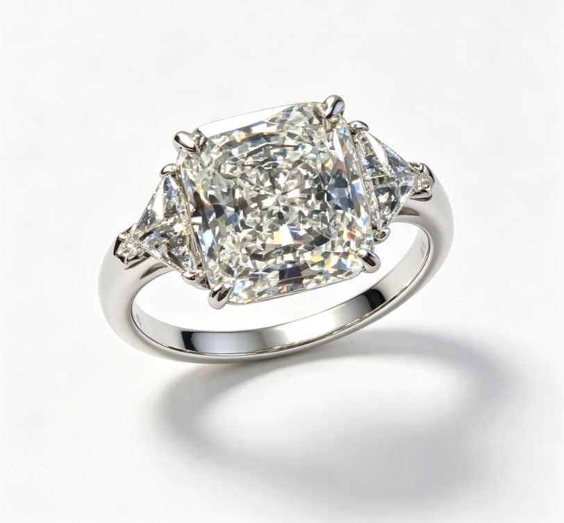 Cushion Cut Three-Stone Diamond Ring with Shield Side Stones