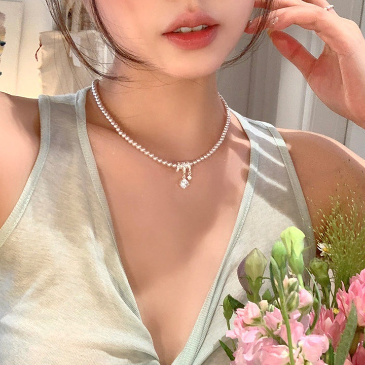 Elegant Pearl Bow Pendant Necklace